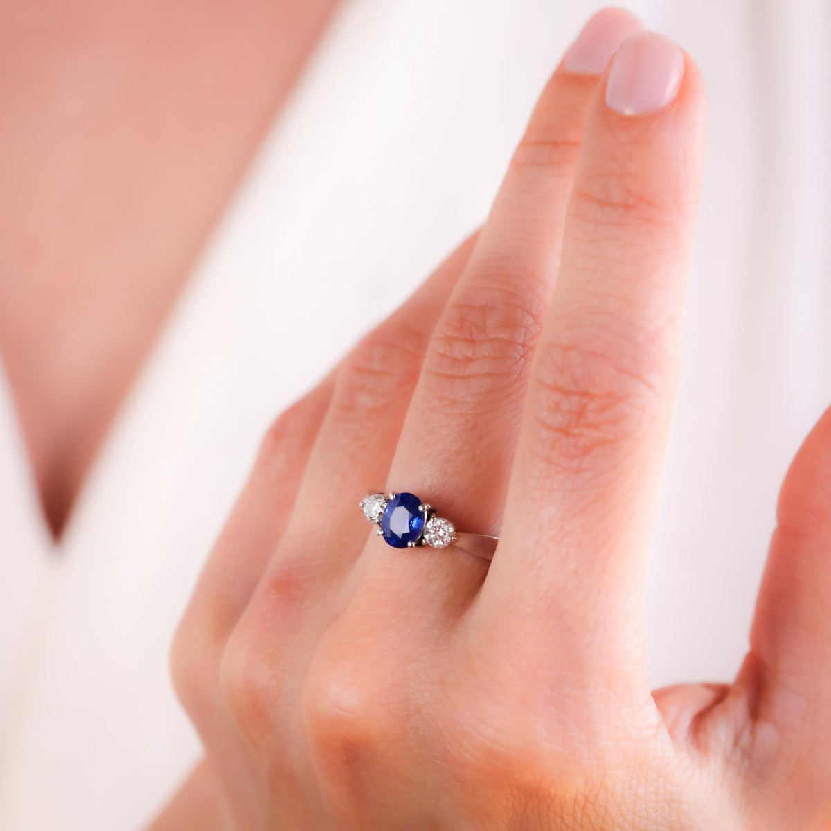 Oval Blue Sapphire Platinum Three Stone Ring