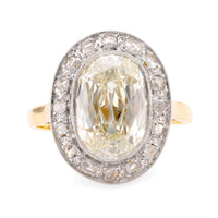 Edwardian GIA 5.02 Carat Cushion Diamond 18K Yellow Gold Cluster Ring