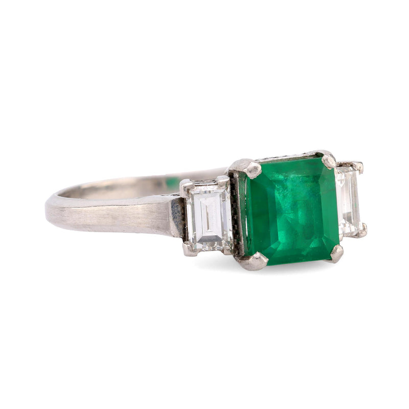 Timeless emerald diamond platinum three stone ring