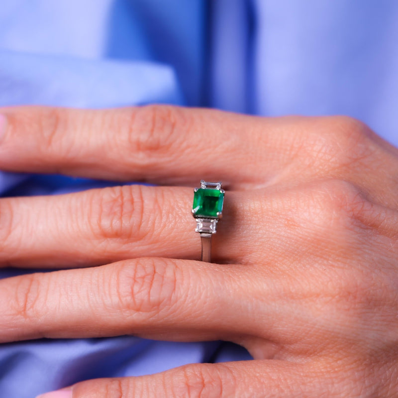 Timeless emerald diamond platinum three stone ring