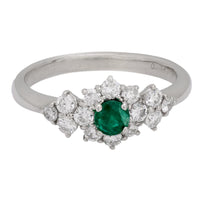 Modern emerald diamond platinum ring