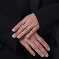 Modern emerald diamond platinum ring