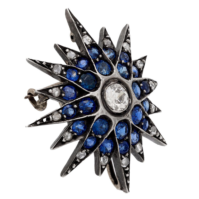 Edwardian diamond sapphire silver and 10k yellow gold star brooch