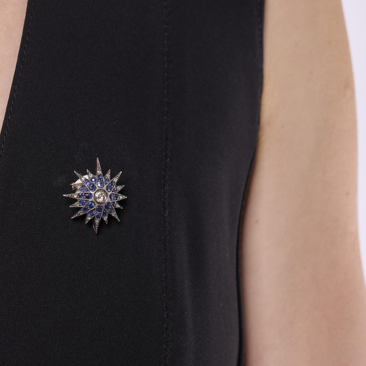 Edwardian diamond sapphire silver and 10k yellow gold star brooch