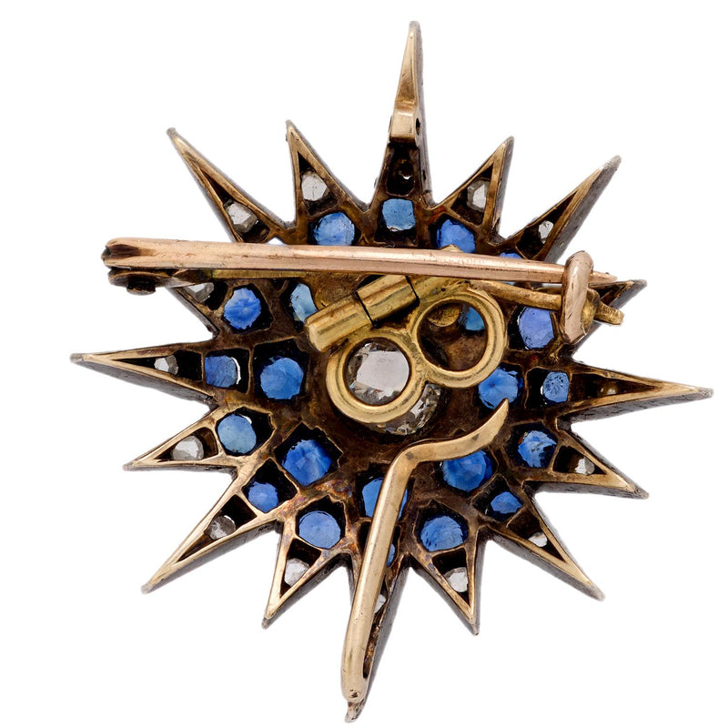 Edwardian diamond sapphire silver and 10k yellow gold star brooch