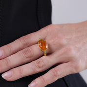 Modern 3.90 carat fire opal 18k yellow gold east-west bezel ring