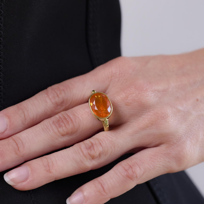 Modern 3.90 carat fire opal 18k yellow gold east-west bezel ring