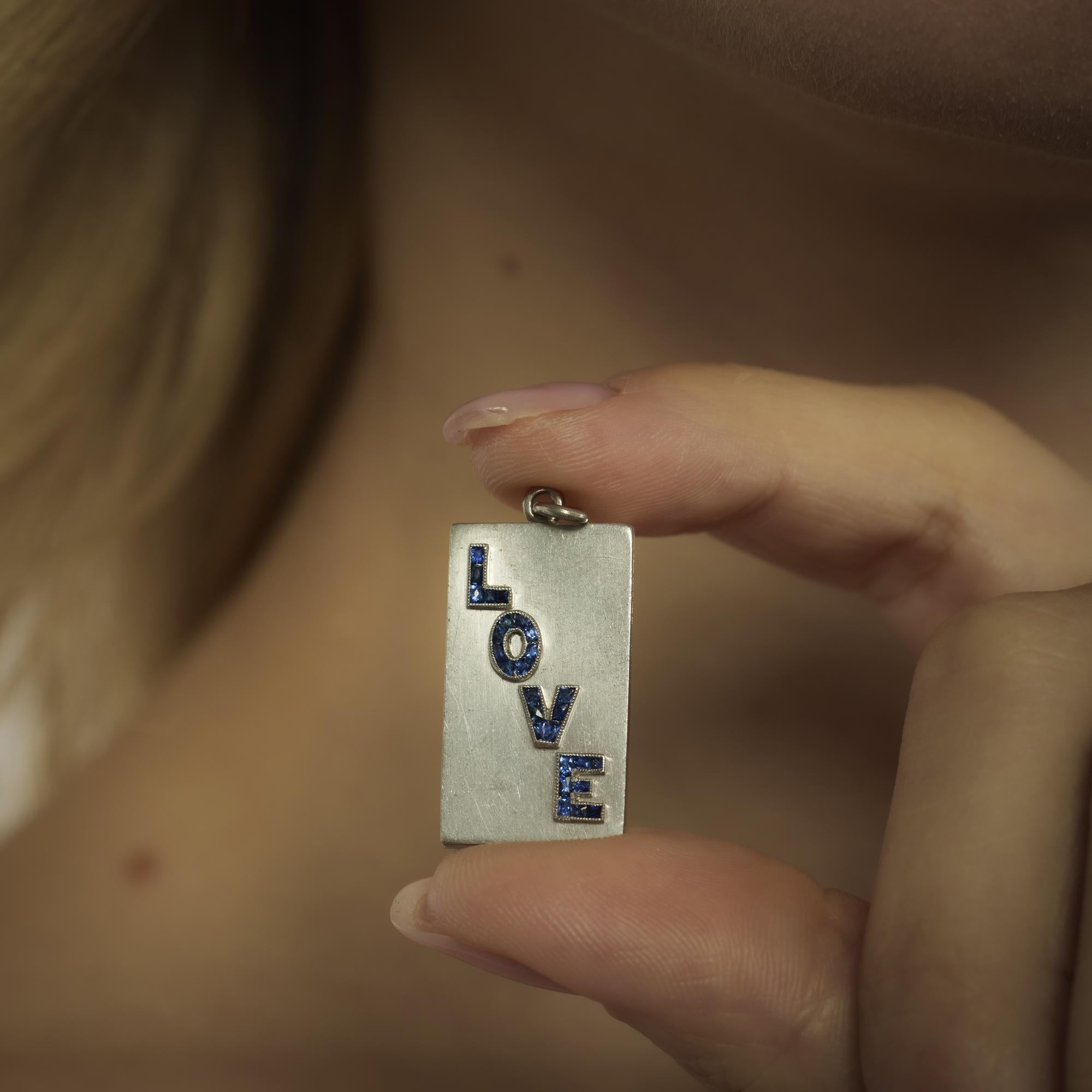 Mid Century sapphire platinum "Love" locket