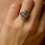 Edwardian Old European cut three stone diamond navette ring
