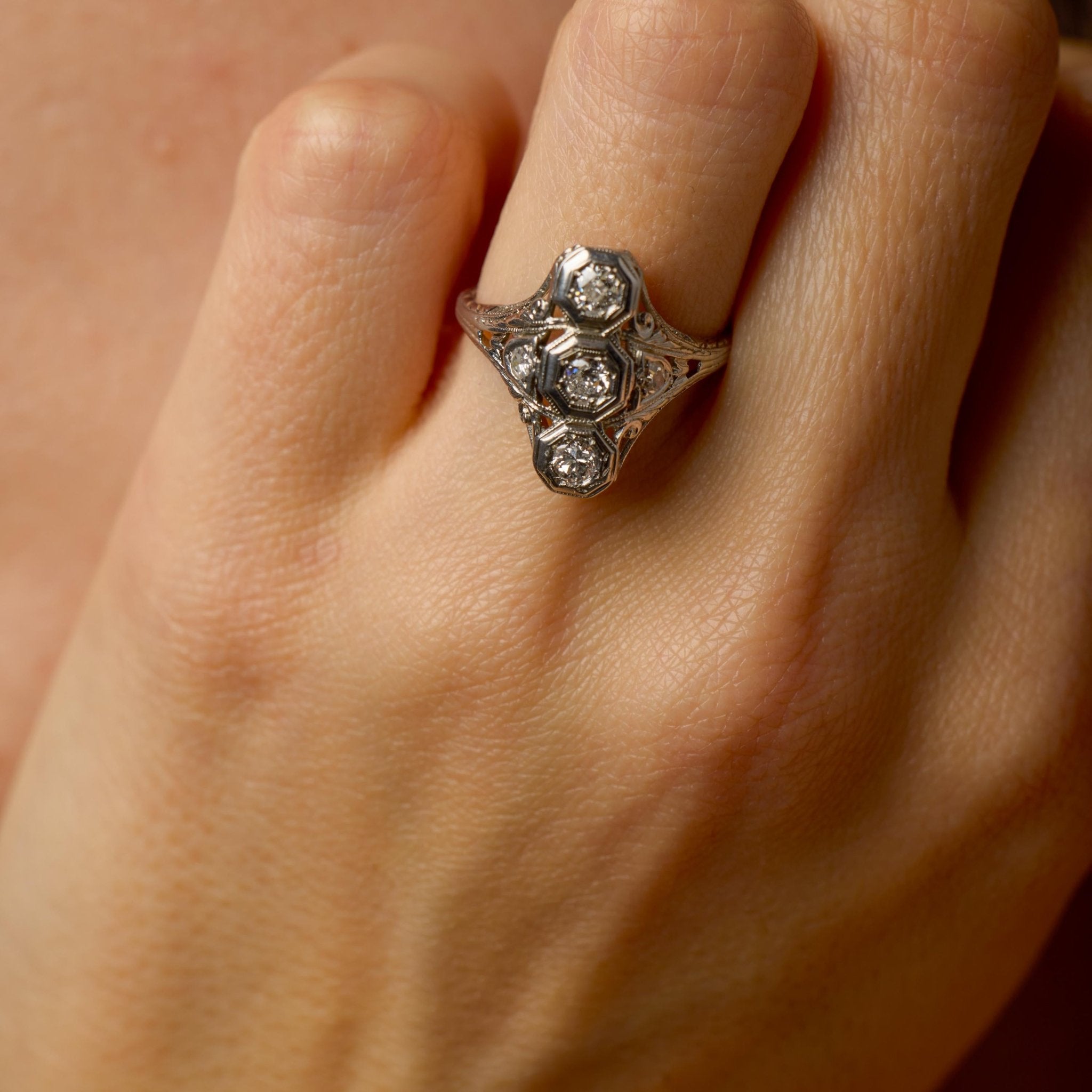 Edwardian Old European cut three stone diamond navette ring