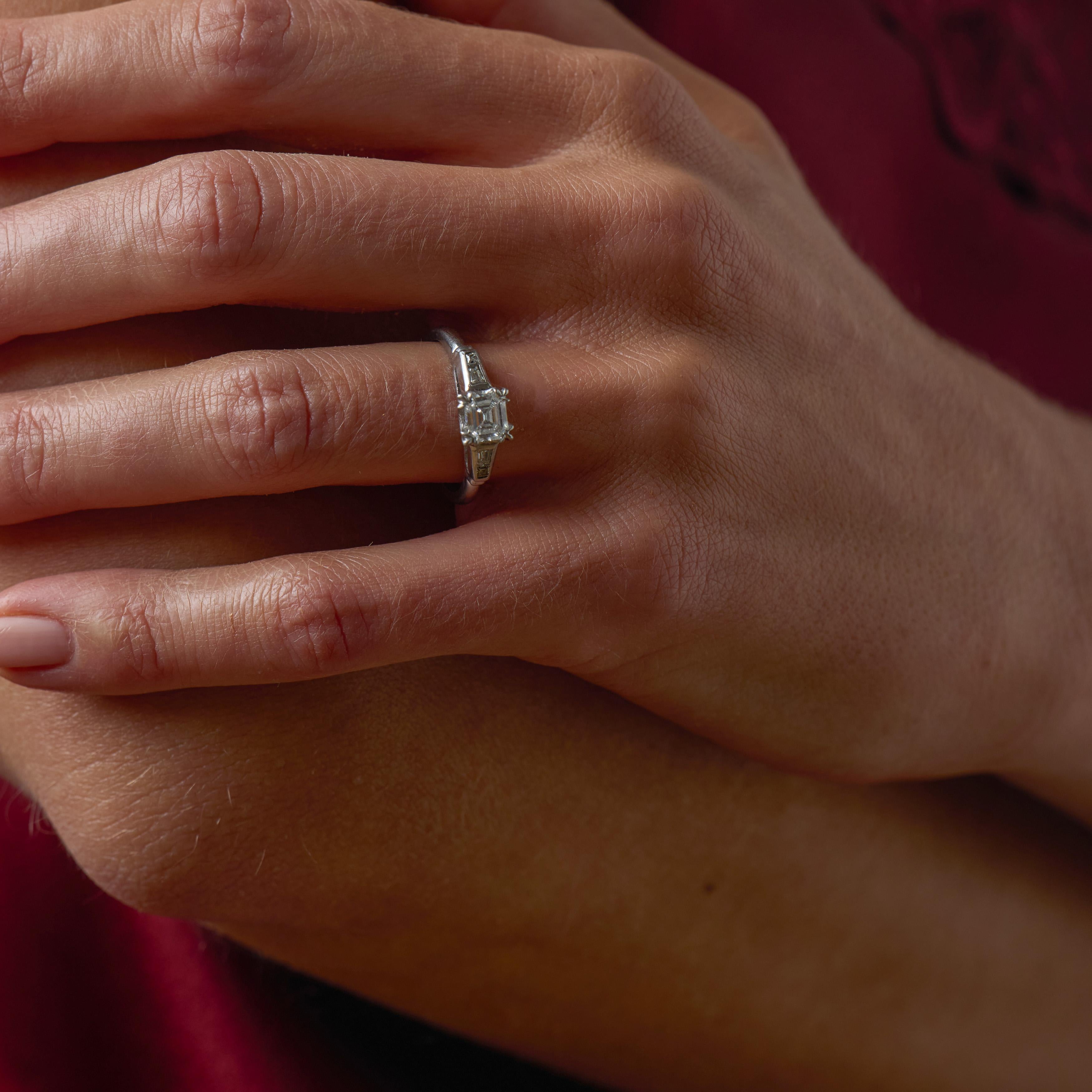 Mid Century step cut diamond platinum engagement ring