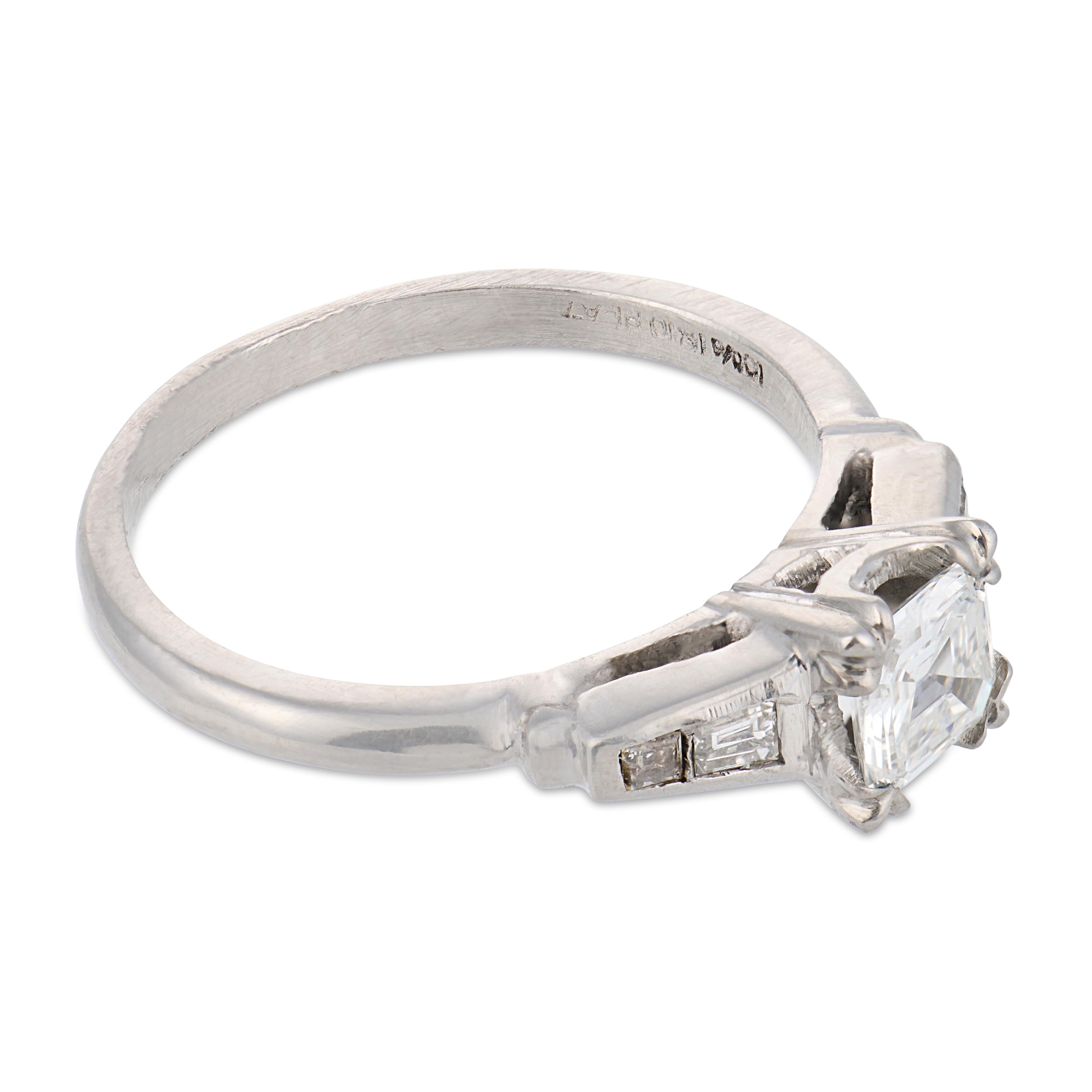 Mid Century step cut diamond platinum engagement ring