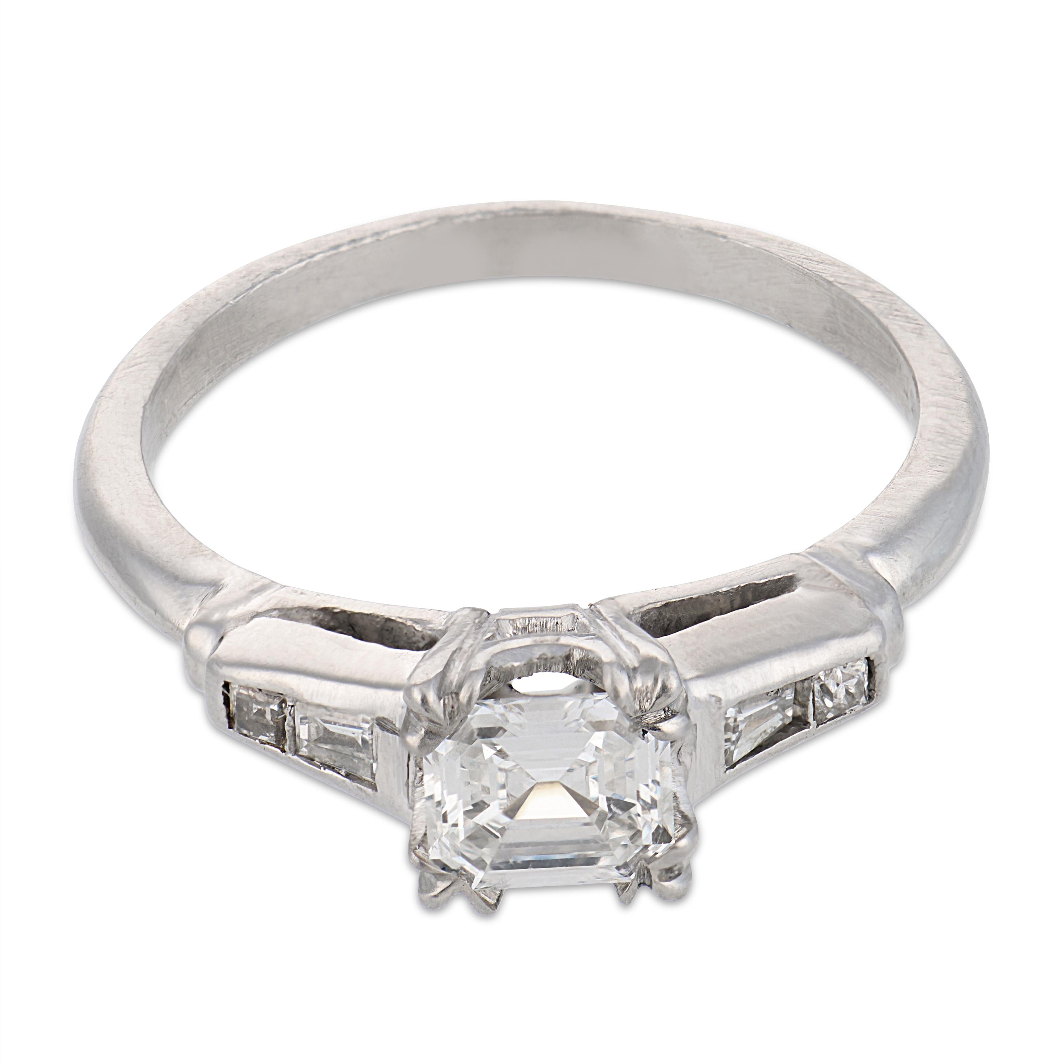 Mid Century step cut diamond platinum engagement ring