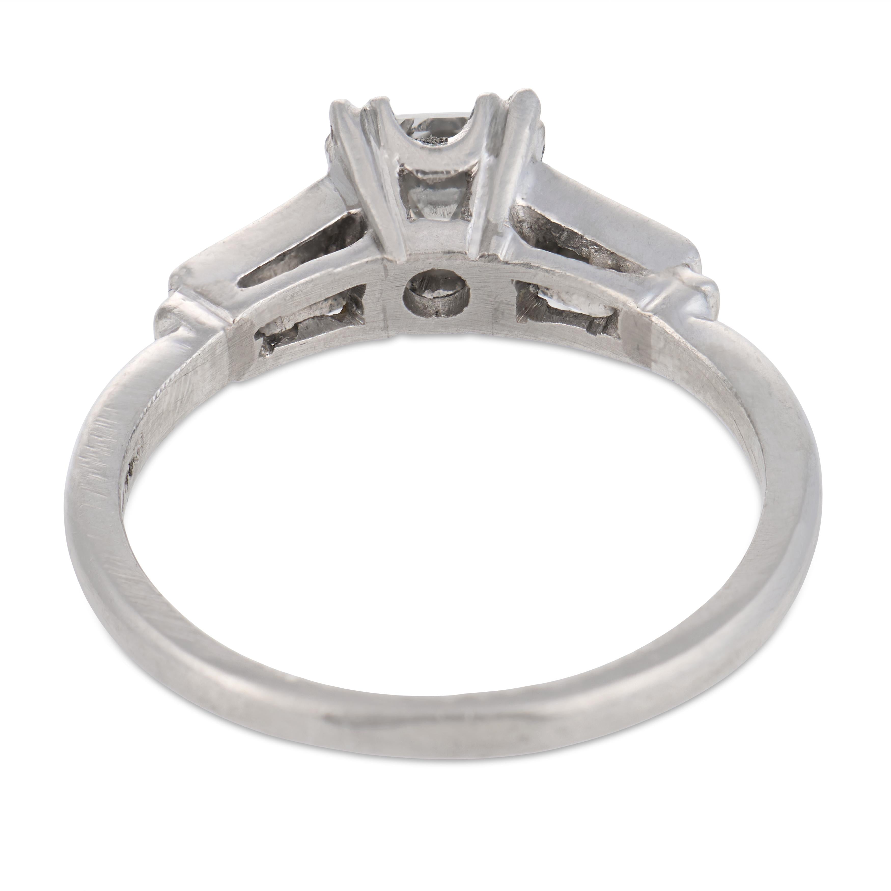 Mid Century step cut diamond platinum engagement ring