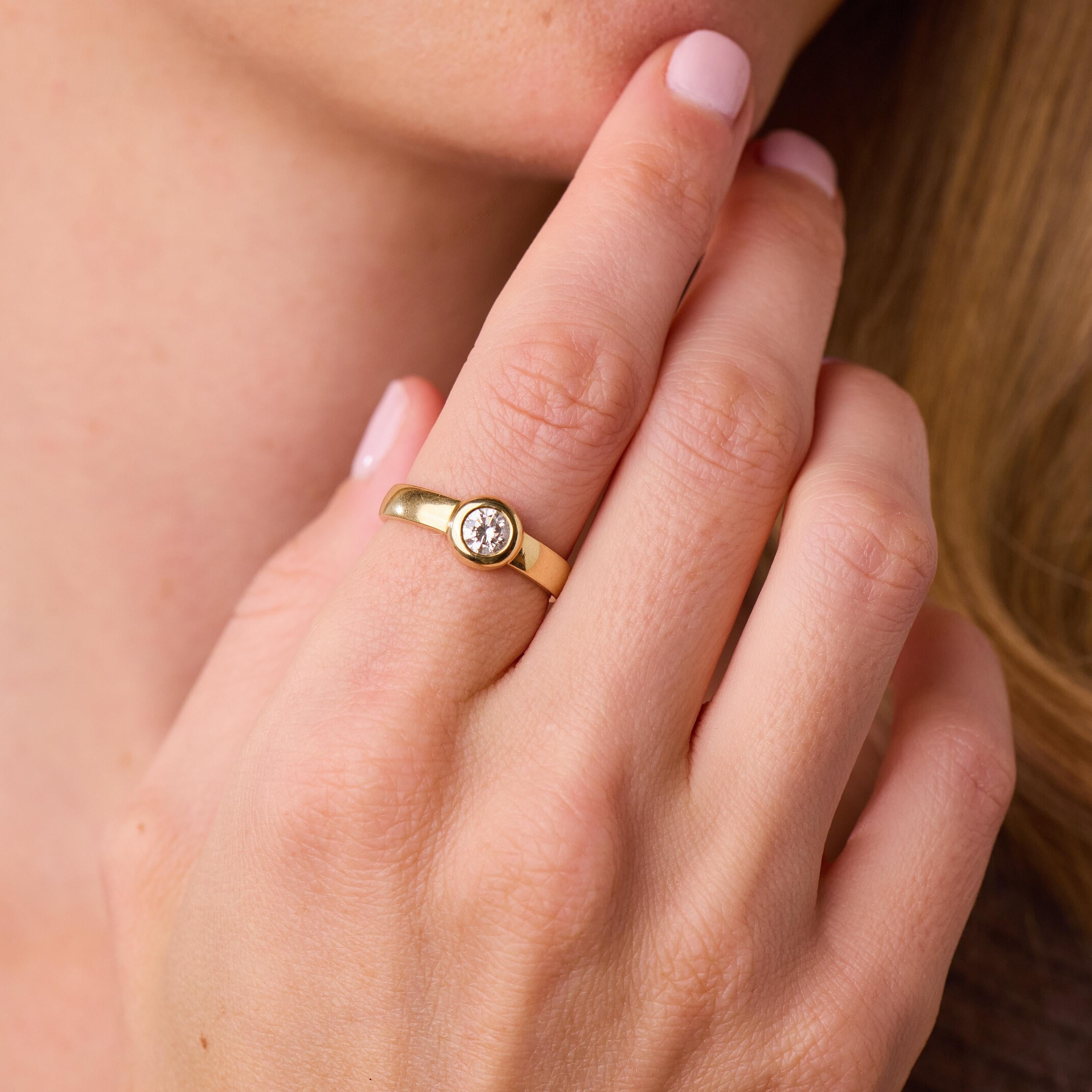Vintage round brilliant cut diamond 14k yellow gold bezel set ring