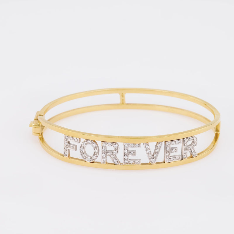 Contemporary diamond 18k yellow and white gold 'forever' bangle