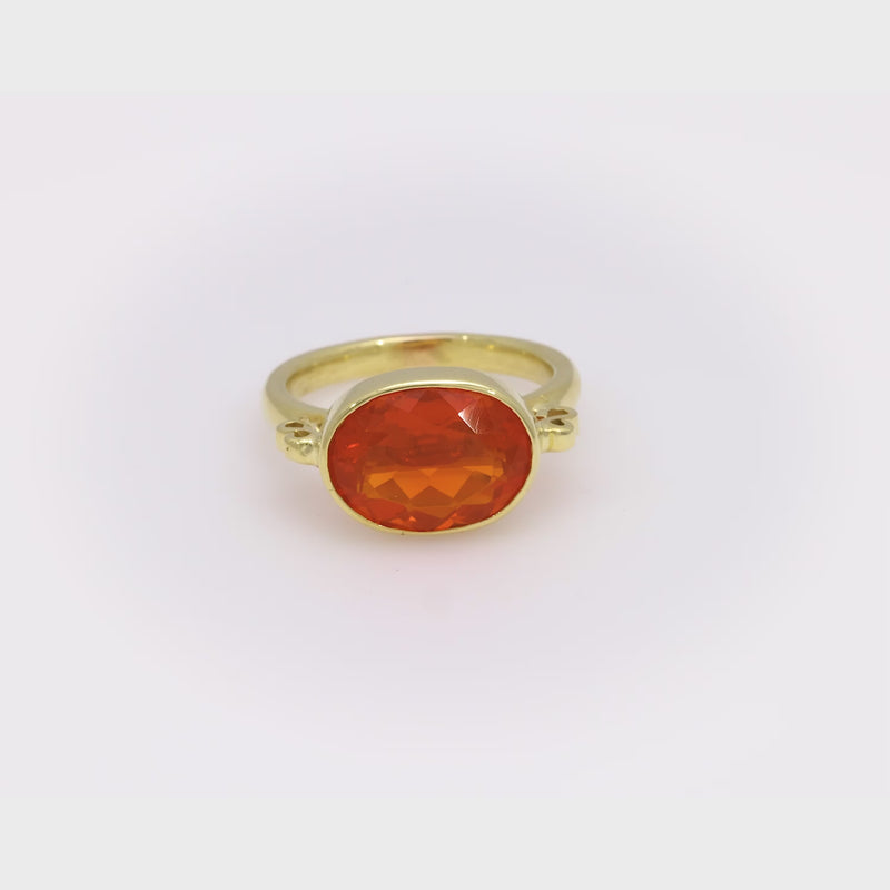 Modern 3.90 carat fire opal 18k yellow gold east-west bezel ring