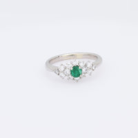 Modern emerald diamond platinum ring