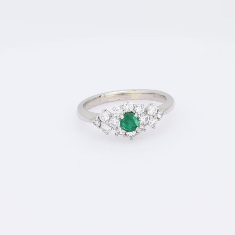 Modern emerald diamond platinum ring