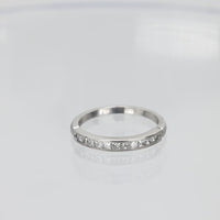 Contemporary princess cut diamond platinum wedding band