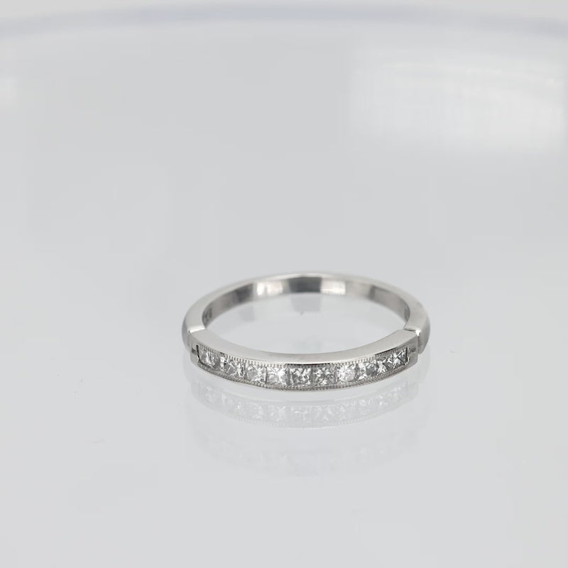 Contemporary princess cut diamond platinum wedding band