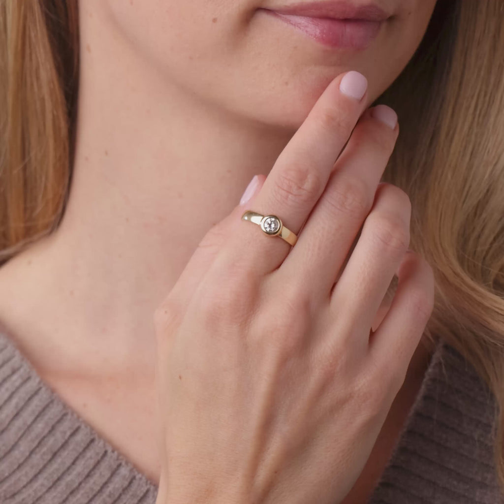 Vintage round brilliant cut diamond 14k yellow gold bezel set ring