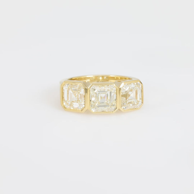 GIA 6.02 carat total weight Asscher cut diamond 18k yellow gold three stone ring