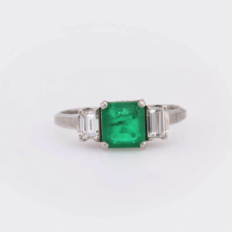 Timeless emerald diamond platinum three stone ring