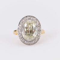 Edwardian GIA 5.02 Carat Cushion Diamond 18K Yellow Gold Cluster Ring