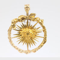 Julius Cohen fancy yellow diamond 18k gold sun pendant