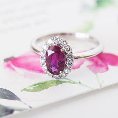 A Beautiful Modern Platinum, Ruby and Diamond Halo Engagement Ring
