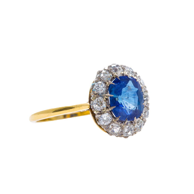 Kamari is a lovely Victorian era antique sapphire and diamond vintage engagement ring set in 18k yellow gold and platinum