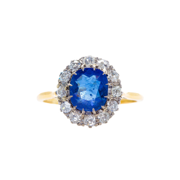 Kamari is a lovely Victorian era antique sapphire and diamond vintage engagement ring set in 18k yellow gold and platinum