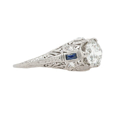 A Beautiful Art Deco Bombe Style Platinum, Diamond and Synthetic Sapphire Ring