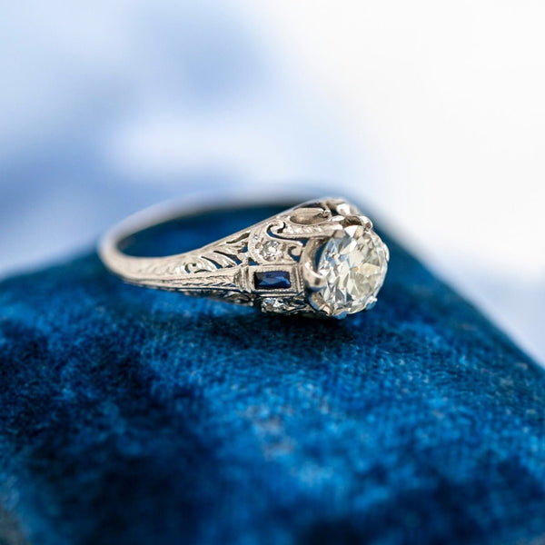 A Beautiful Art Deco Bombe Style Platinum, Diamond and Synthetic Sapphire Ring