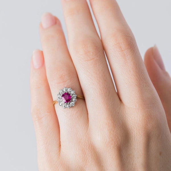A magnificent Authentic Victorian Era Burma No Heat Ruby and Diamond Halo Ring on hand