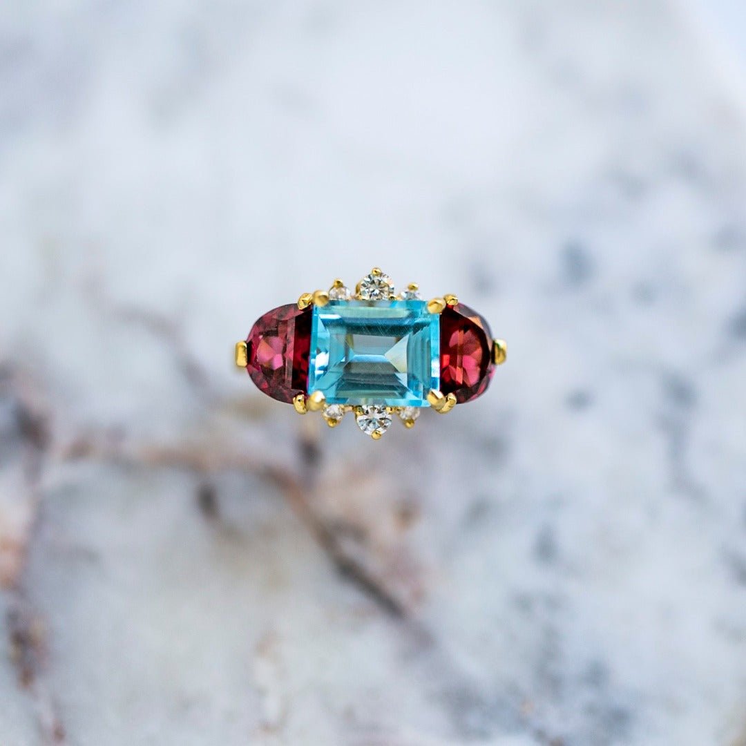 Modern East-West 4.36ct Blue Topaz & Half Moon Rhodalite Garnet Ring | Kew Gardens