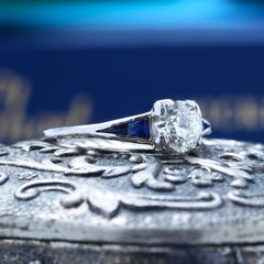 A Striking Art Deco Platinum, Diamond and Sapphire Engagement Ring