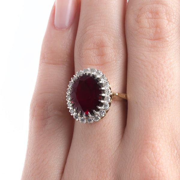 Retro Era Cocktail Ring with Oval Garnet and Diamond Halo | Peppertree Lane from Trumpet & Horn